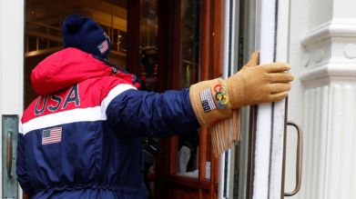 An Olympic athlete shows off his American Olympic gloves