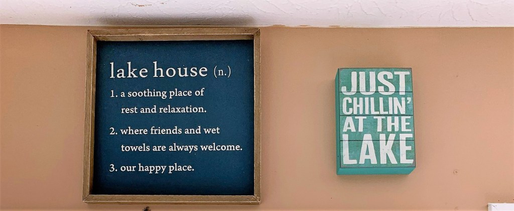 2 cheesy lake house signs 